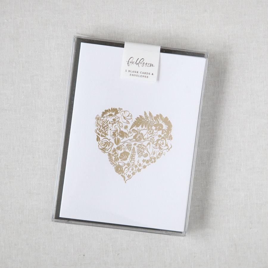 Flora-Heart card box set, a simple yet elegant card, featuring a heart-shaped floral design rendered in gold foil, centered on a crisp white background.