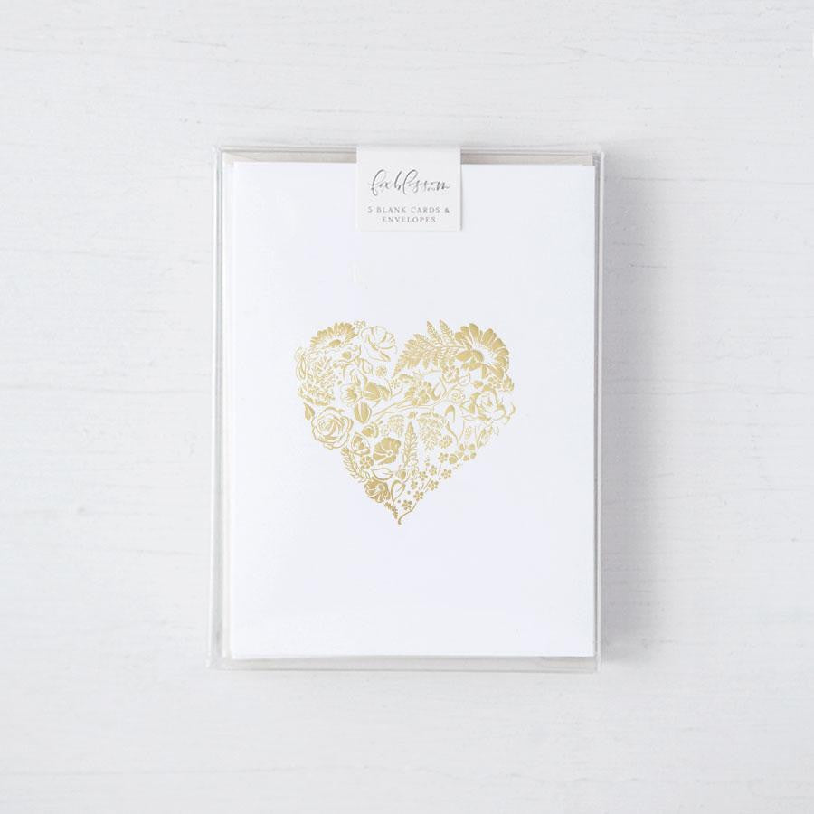 Flora-Heart card box set, a simple yet elegant card, featuring a heart-shaped floral design rendered in gold foil, centered on a crisp white background.