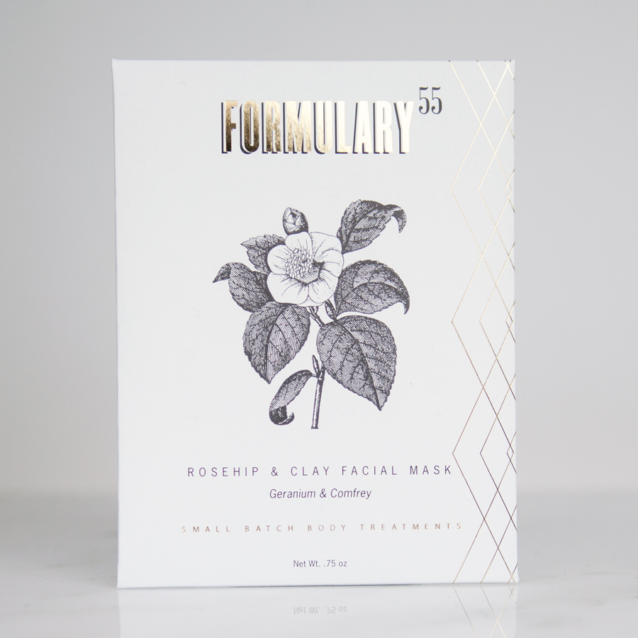 Rosehip + Clay Facial Mask in a .75 oz white packet. with black and gold text, with a black flower graphics.