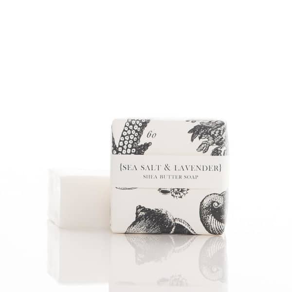 2 oz. Sea Salt & Lavender scented Shea Butter Soap, in a white and black sea life graphic pattern wrapper. Soap is white colored, wrapped in a white/clear colored wrapper.