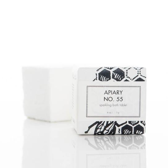 4 oz. no, 55 Sparkling Bath Tablet, in a hite and black honeycomb graphic pattern wrapper. Soap is white/cream colored, wrapped in a white colored wrapper