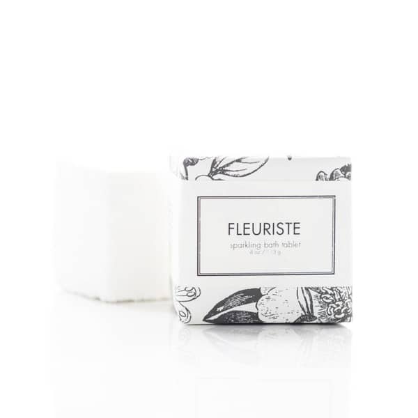 4 oz. Sparkling Bath Tablet, in a white and black flower graphic pattern wrapper. Soap is white/cream colored, wrapped in a white/clear colored wrapper