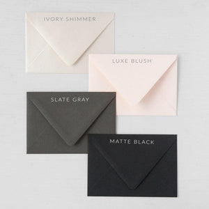 Four envelope color options, ivory shimmer, luxe blush, slate gray, and matte black.