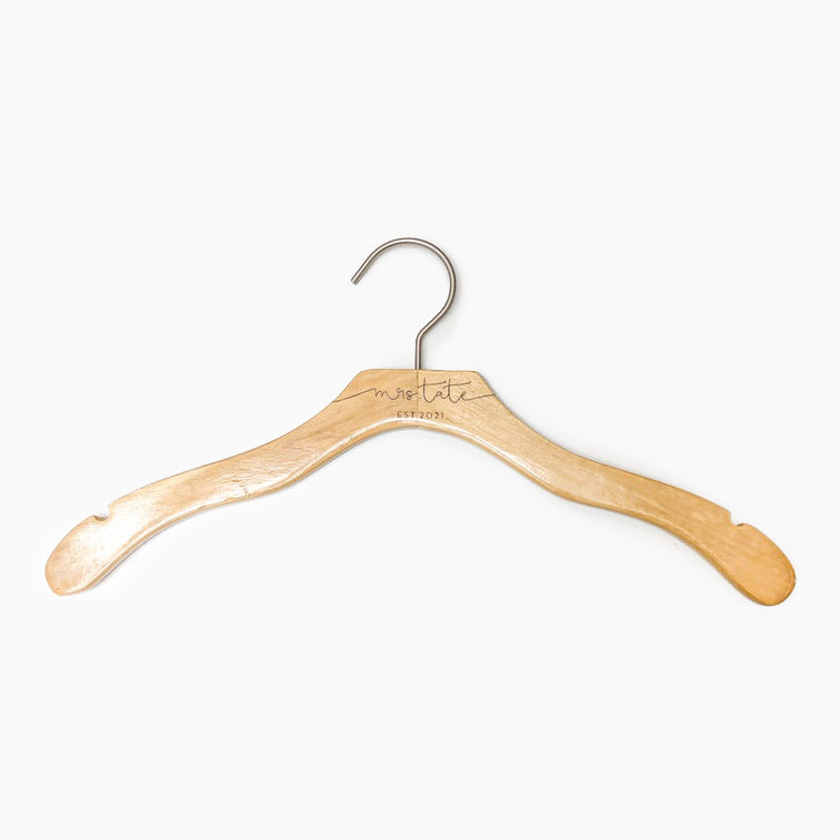 Custom engraved bridal party hanger - natural wood with varnish, silver hook, engraved with bride's name in script and "BRIDE" in all caps underneath.