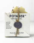 A light beige box, tied with twine, holds a bar of French Lavender soap.
