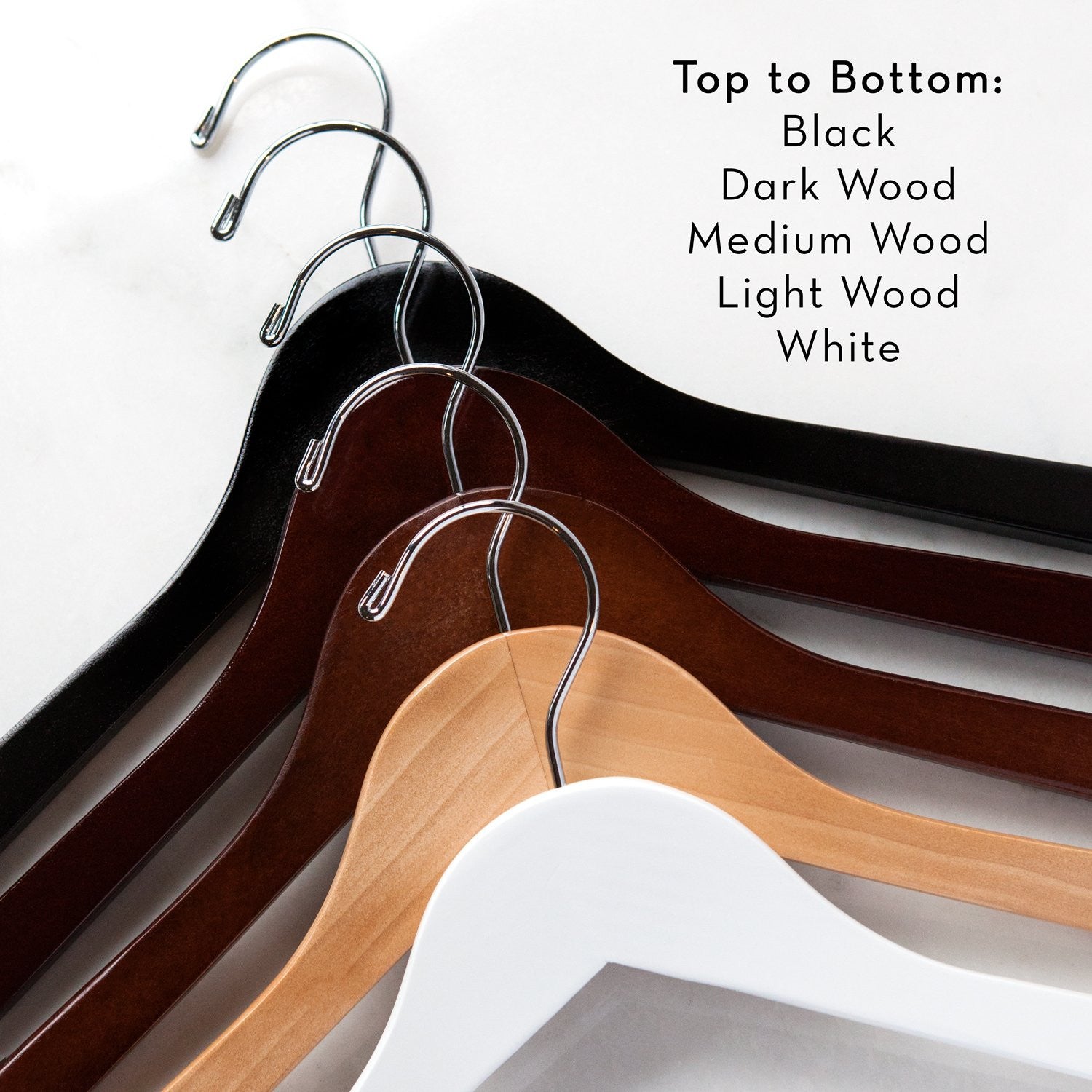 Dark wooden hanger with satin bow and silver hook. Personalized base wire shaped into name