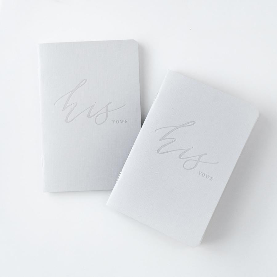 His and his gray linen letterpressed vow books, featured in a white background