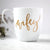 White ceramic mugs, two 15 oz mugs, "hubby" in black script font, "wifey" in gold script font
