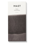 Mast Brother, Dark Chocolate Bar, wrapped in a White and shades of brown background. Label in the white part with black lettering. 