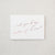 White envelope size card (approx. 3.5" x 5"), reads, "Will you be my matron of honor?" in rose gold text.