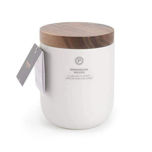 white ceramic candle with wooden lid in norwegian woods scent