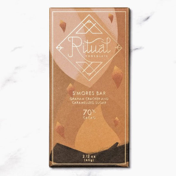 Ritual smores chocolate bar, with multiple shades of orange in the design of a fire with gold foil text.
