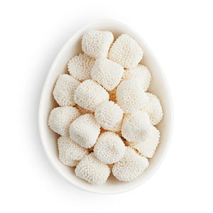 Small white ovular dish containing white gummy drops covered in white nonpareils.