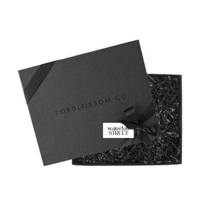 Black gifting box, with black ribbon around the box, customer logo printed on tag. 