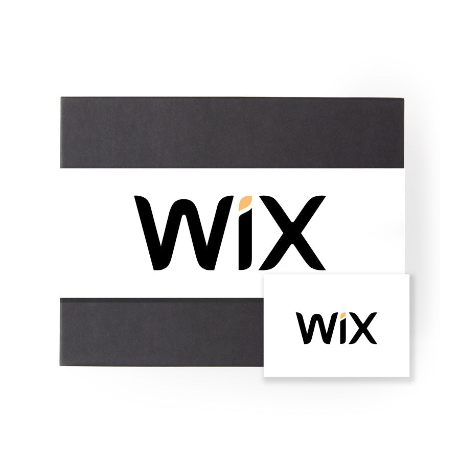 A black &#39;foxblossom&#39; box with a white &#39;wix&#39; belly band, and a white card with the same &#39;wix&#39; graphic printed on front.