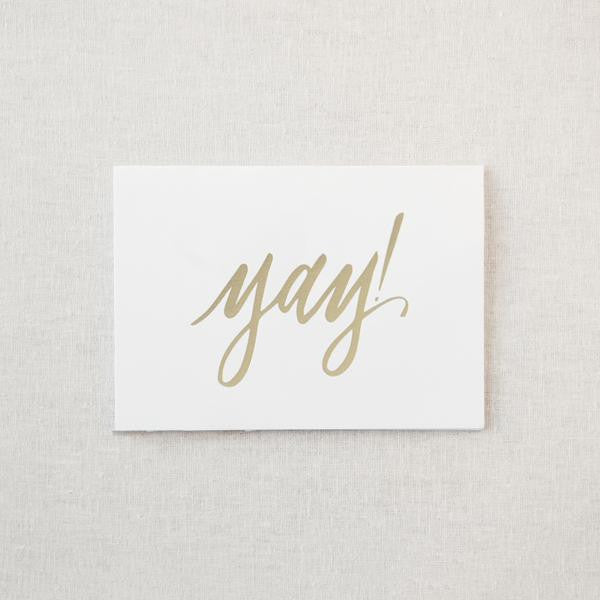 White greeting card with gold foil "Yay!"